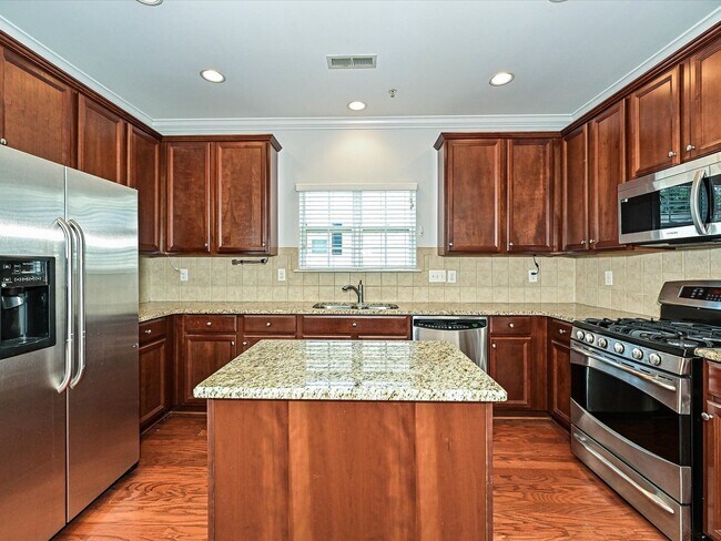 Building Photo - Stylish Condo Living with Open Concept, Garage & Outdoor Space