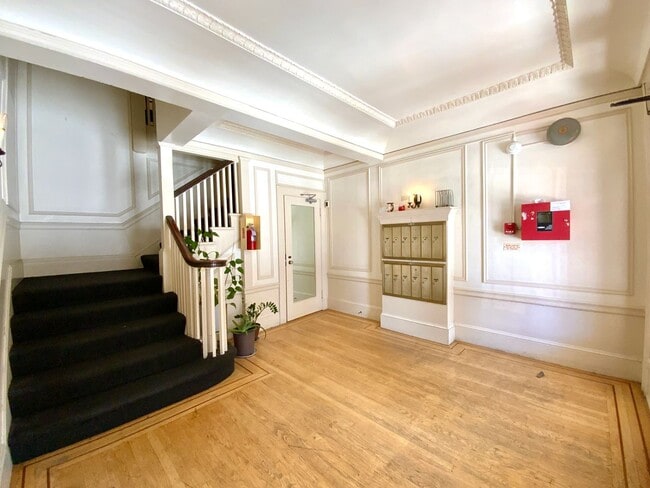 Building Photo - RENOVATED and Private. DISHWASHER, ON-SITE LAUNDRY, HARDWOOD!