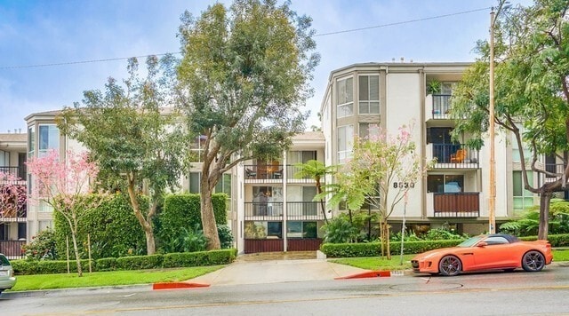 Building front with lush greenery - 8530 Holloway Dr