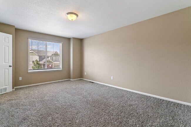 Building Photo - Spacious Banning Lewis Home with Finished ...