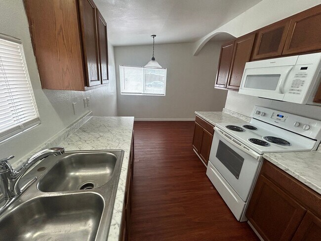 Building Photo - Single story home with large backyard and huge carport with plenty of storage.