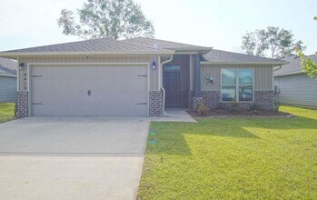 Building Photo - Popular Floor Plan, Almost New Home in Woo...