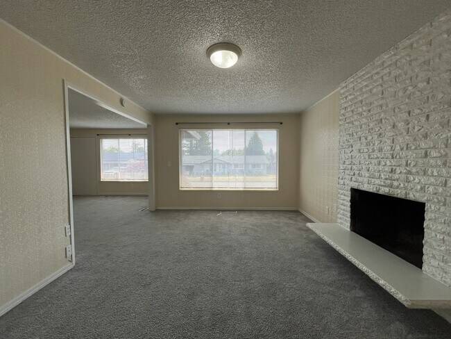 Building Photo - Charming Ranch Home with Sunroom or 4th Bedroom, Two-Car Garage and Fenced Backyard