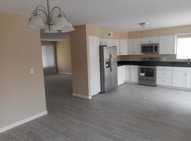 kitchen and living room have since been painted - 654 W Gable Ave