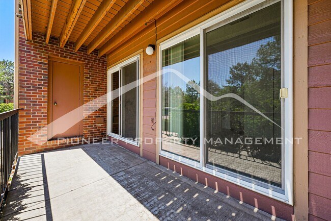 Building Photo - Charming Condo with Washer/Dryer and Patio