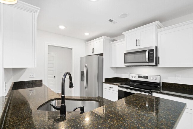 Building Photo - Pet Friendly Three Bedroom with Bonus!