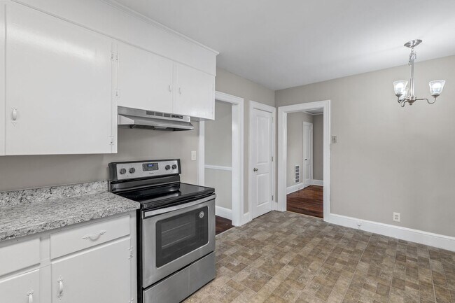 Building Photo - SW, Large Brick Two Bedroom PLUS Two Sun-Rooms, Hardwoods, LR & Separate DR, Fire Place!