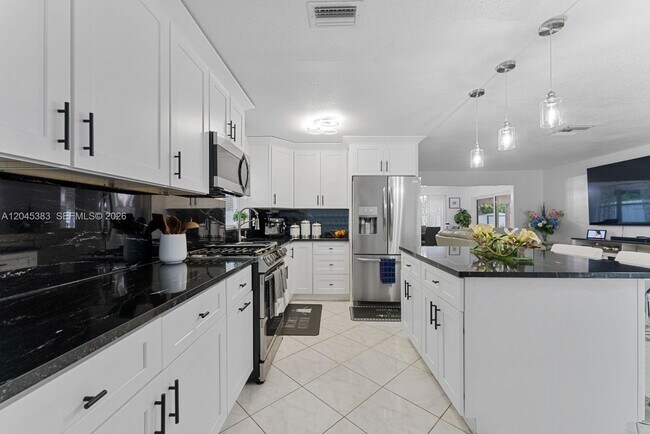 Building Photo - 9508 N Military Trl