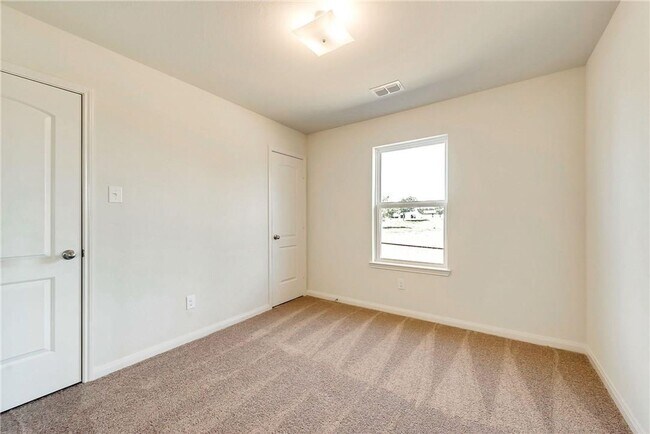 Building Photo - This lovely 4 bedroom home features a large family room with lots of light.