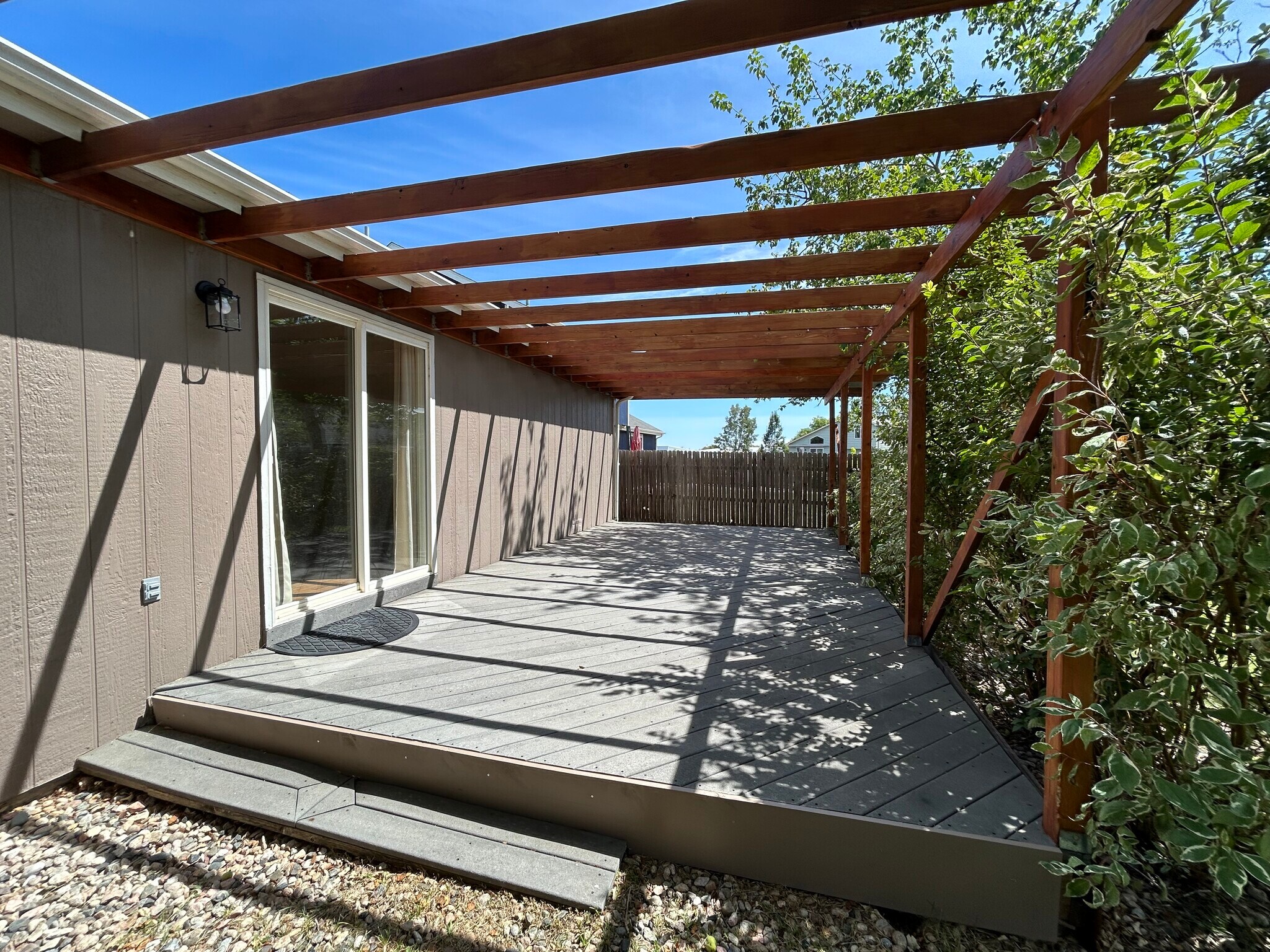Sliding glass doors from the dining area inside leads to the pergola covered deck - great for outdo - 4393 N Lincoln Ave