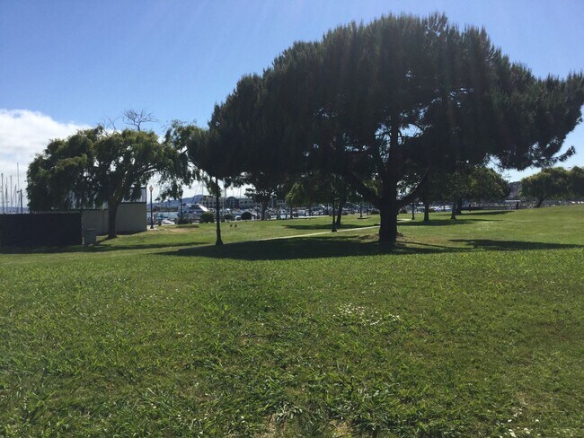 Building Photo - Exceptional Corner Unit w/ Wraparound Sout...