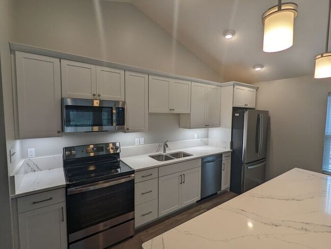 Building Photo - Experience modern living in this beautiful...