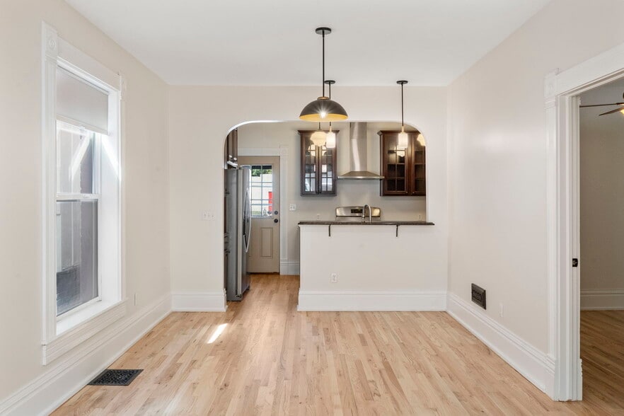 Kitchen is also open to the main floor for easy entertaining. - 3347 Tejon St