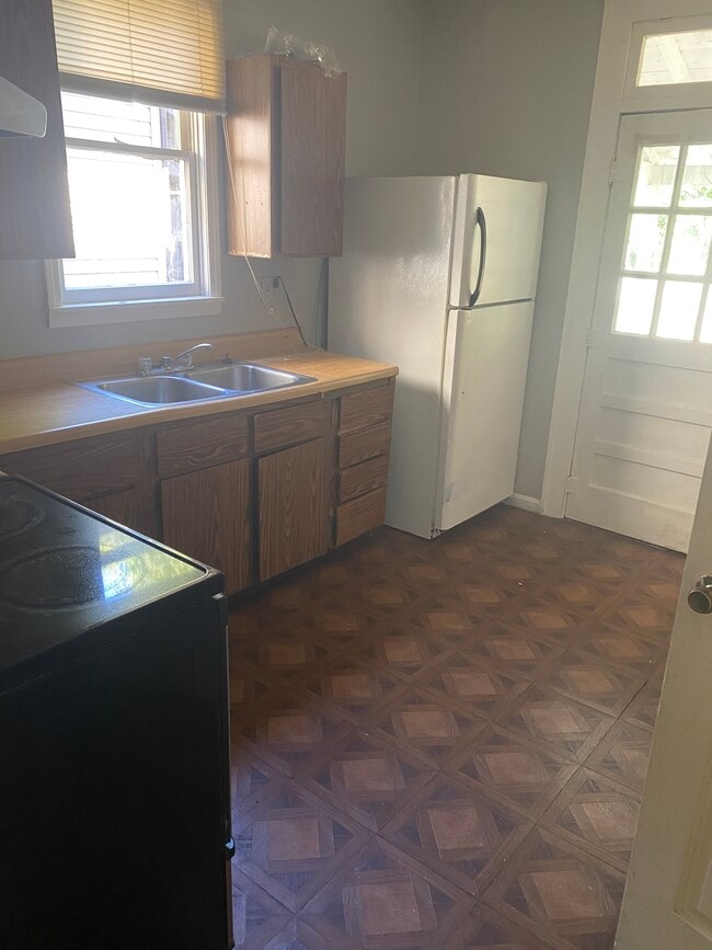Kitchen range,ss s ink refrigerator and back door entry - 362 E Markison Ave