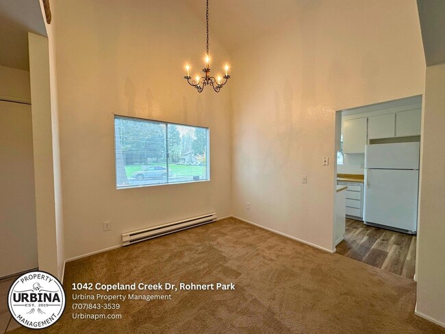 Building Photo - Charming 2-Bed, 1.5-Bath End-Unit Condo in...