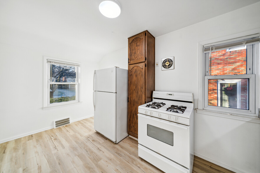 Kitchen with street view. Appliances to be updated prior to move-in. - 16079 Forest Ave