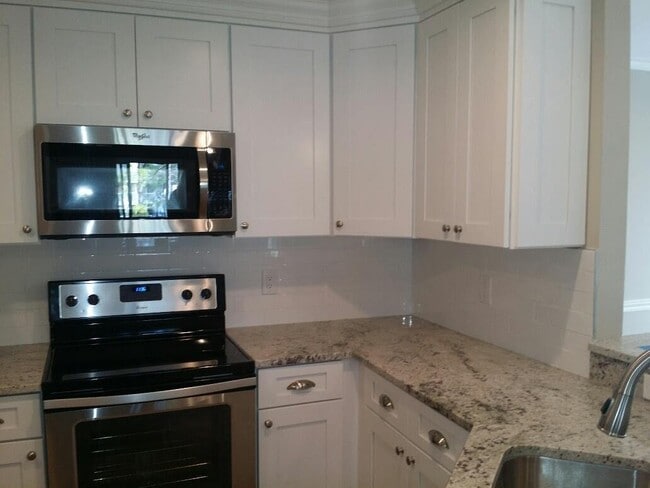 Building Photo - Completely Renovated 3rd Floor condominium with panoramic views GARAGE INCLUDED!