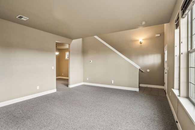 Building Photo - Spacious 4-Bedroom Home with New Paint & Carpet, Fenced Yard