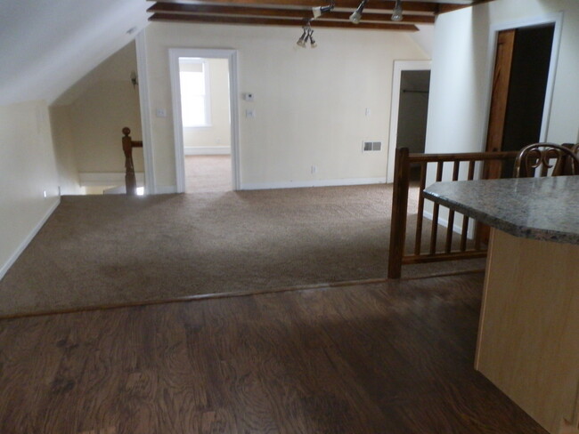 large living room - beams and ceiling fans and skylight - 81 Bay St