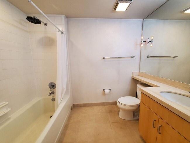 Building Photo - Downtown High-Rise Studio with parking and in-home laundry