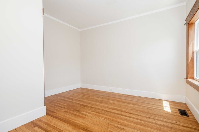 Second bedroom with natural light and storage. - 431 Athol Ave