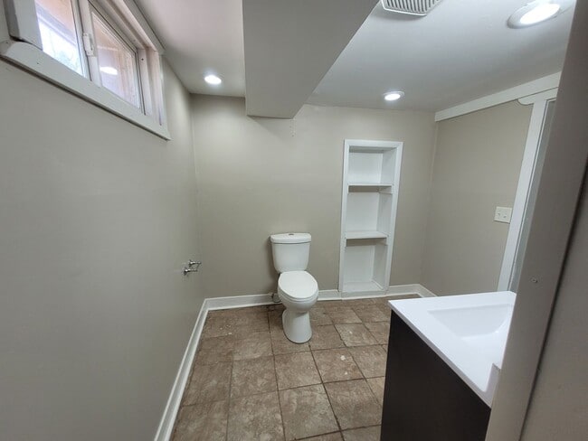 Building Photo - Four bedroom home on Indianola Ave with large yard and two decks!