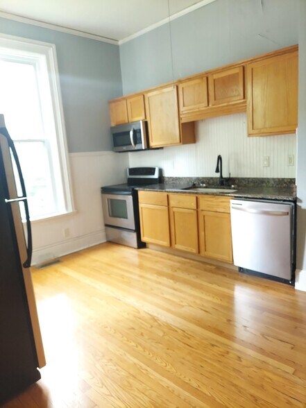 Kitchen With Granit Counters and stainless Appliances - 705 W Healey St