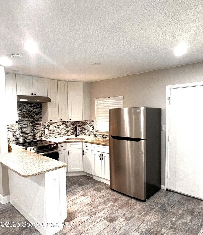 Building Photo - 5600 N Banana River Blvd