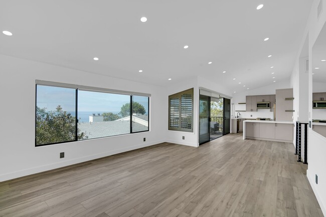 Building Photo - Coastal Bliss Awaits: Luxurious 3-Bed, 3.5...