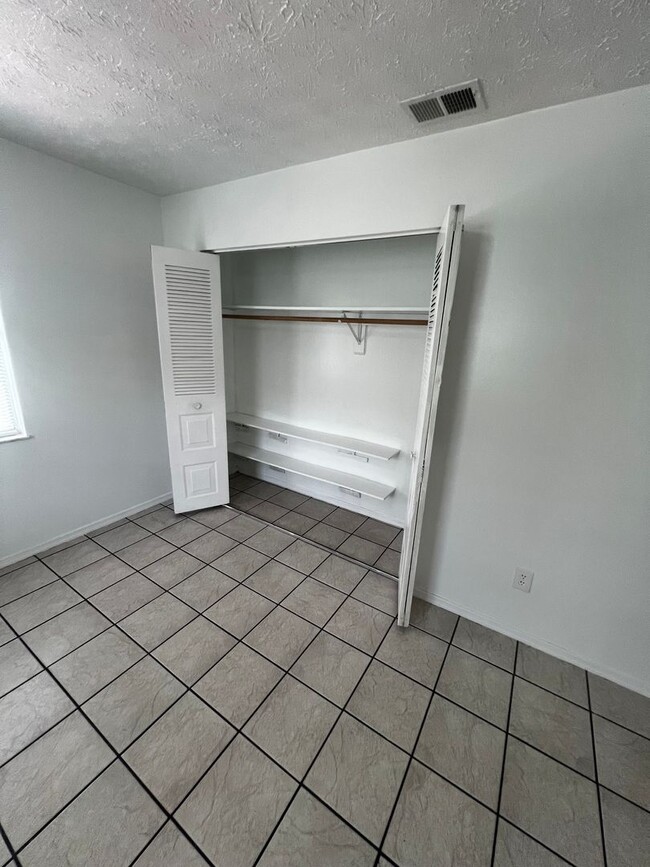 Building Photo - 3 BEDROOM 2 BATH CONVENIENTLY LOCATED WITH A TROPICAL OASIS IN THE BACK YARD!