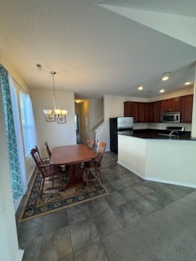 Building Photo - Relax and Unwind in this Spacious End-Unit...