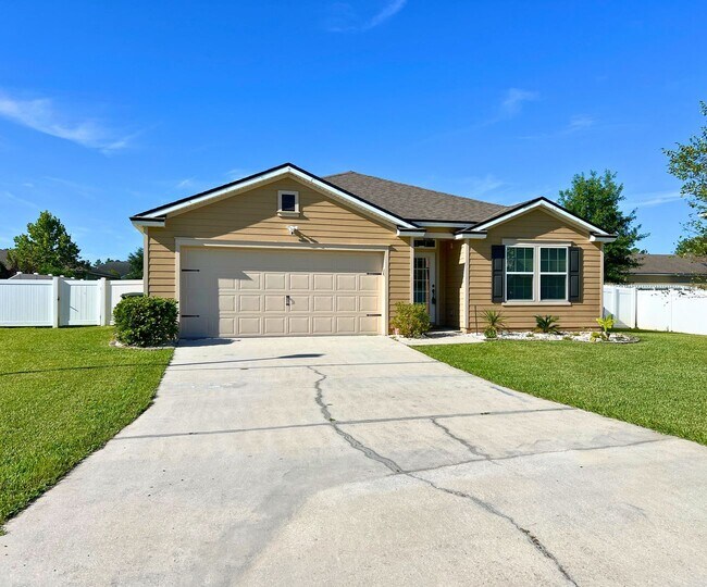 Building Photo - Stylish 4-Bedroom Home with Fenced Yard – ...