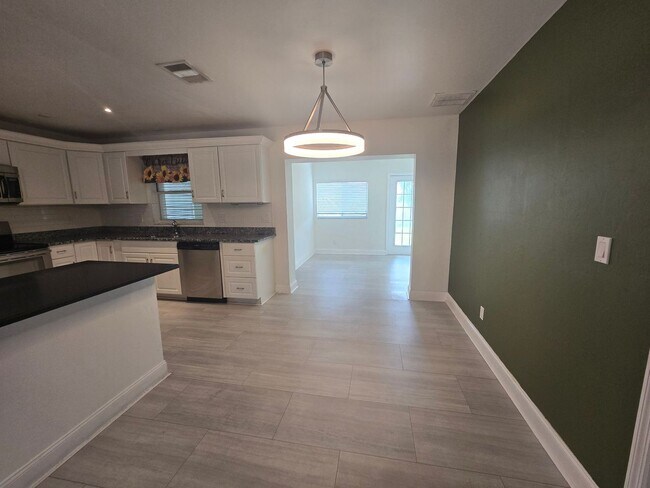 Building Photo - 3 Bedroom W/ Den + Office Space + 2 Car Garage and Fenced in Yard - Annual Rental