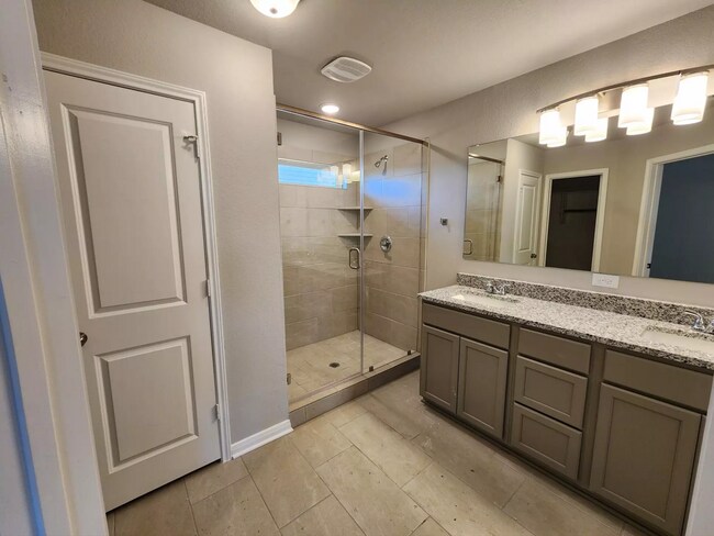 master room bathroom with walk-in closet and water closet - 9811 Kensley Rose Dr