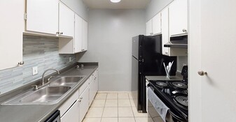 Kitchen with new backsplash - The New Horizon