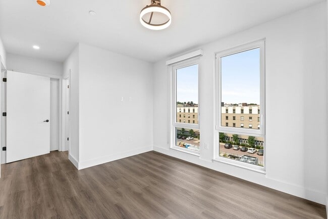 Building Photo - 2 Bedroom Corner-Unit with Wooded Balcony ...