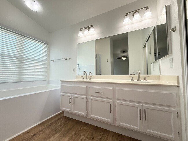Building Photo - Corner Lot Beauty with Open Living, Guest Suite Down & Expansive Backyard