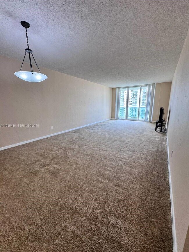 Building Photo - 19380 Collins Ave