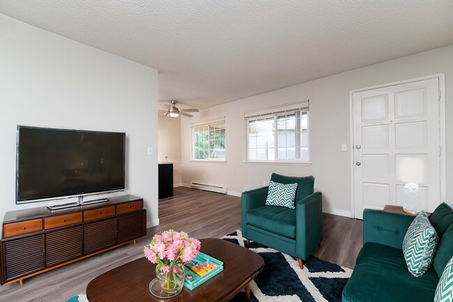 Step into a chic and airy living room designed for modern comfort. - University Crossing Apartments