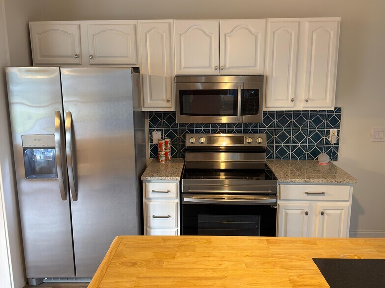 Kitchen with new fridge - 302 N Sumner St