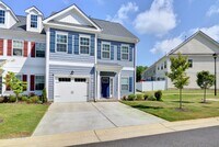 Building Photo - Immaculate End-Unit Townhome