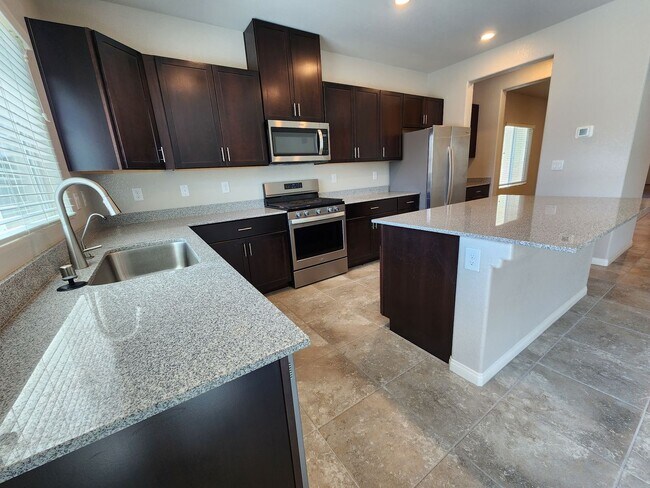 Building Photo - A Fairly New Home with 5 Bedrooms in a gated community