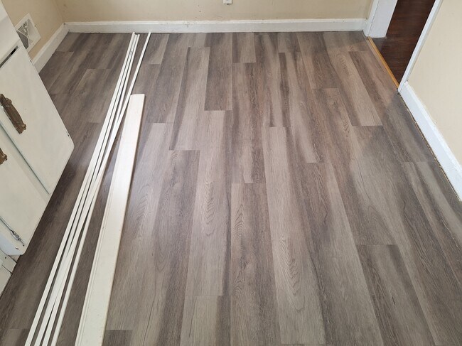 Kitchen floor (new vinyl plank) - 6105 Oakdale Ln