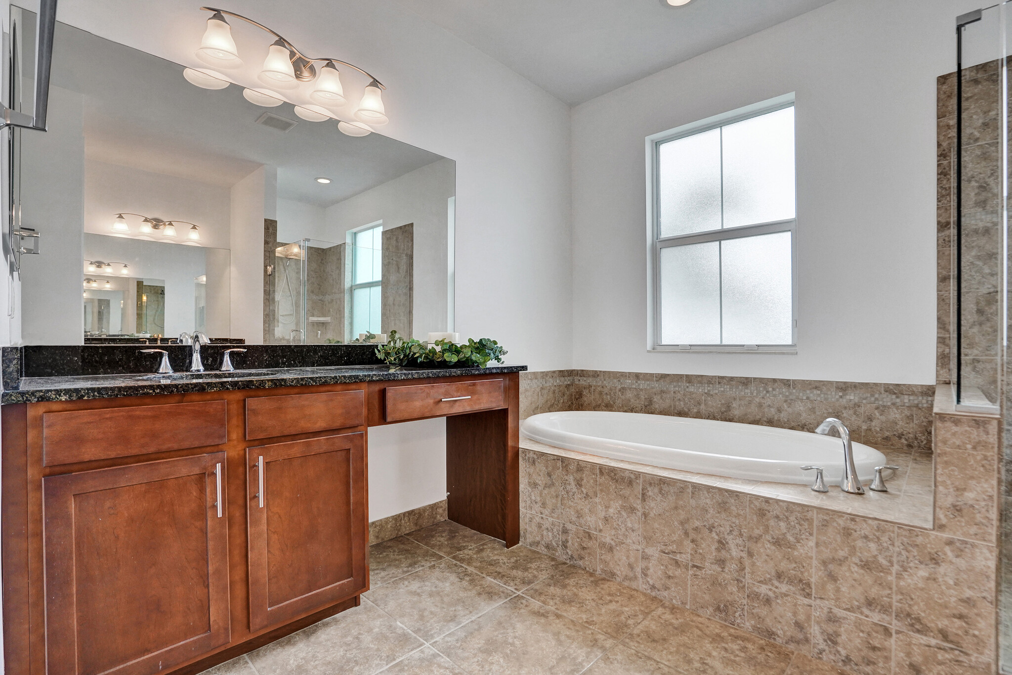 primary bathroom \ double sink \ tub and shower - 6455 SW 55th Pl