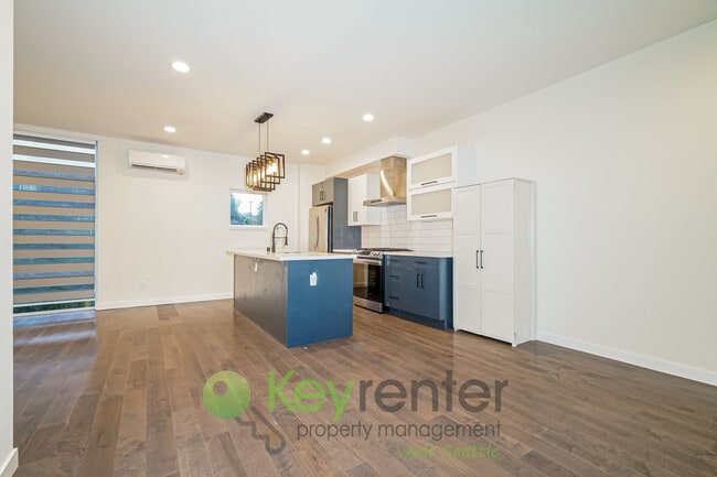 Building Photo - Rooftop Living with Open Concept Design and Parking Included