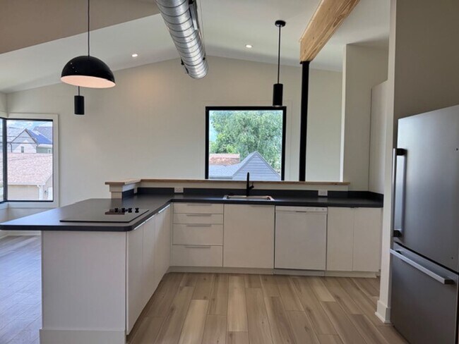 Building Photo - Vaulted Ceilings & Hardwood Floors in This Charming Indianapolis L