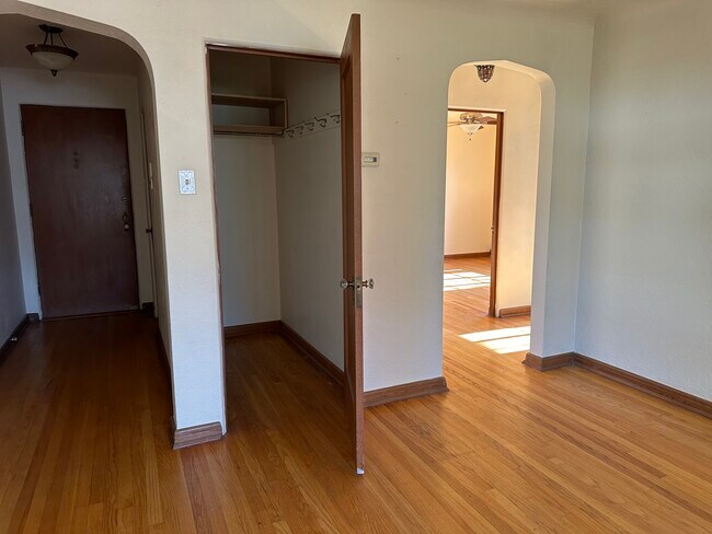 From left to right, front door, closet bedroom in back on right - 2233 Kearney St