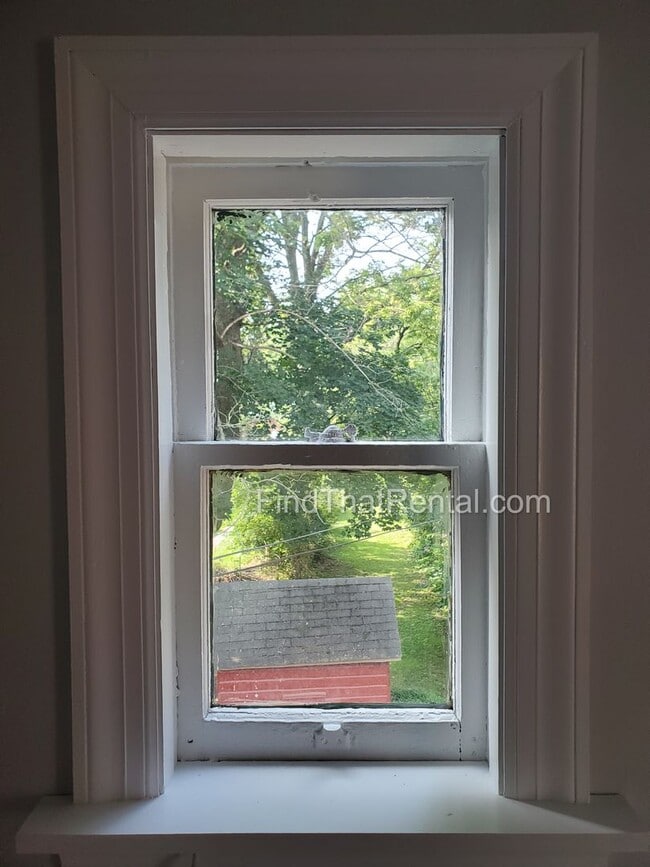 Building Photo - Charming Historic Retreat with Private Fenced Yard & Parking – Prime Downtown Location