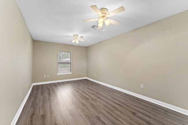 Building Photo - Beautifully remodeled 4 bedroom bath and a half with ceramic tile through out and laminate floori...