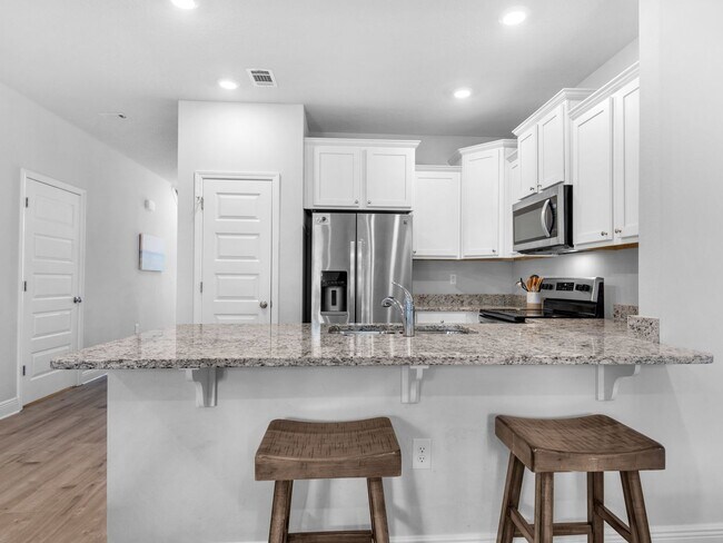 Building Photo - Brand New Furnished Townhome located just ...